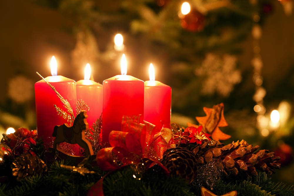 Advent wreath illuminated by candlelight